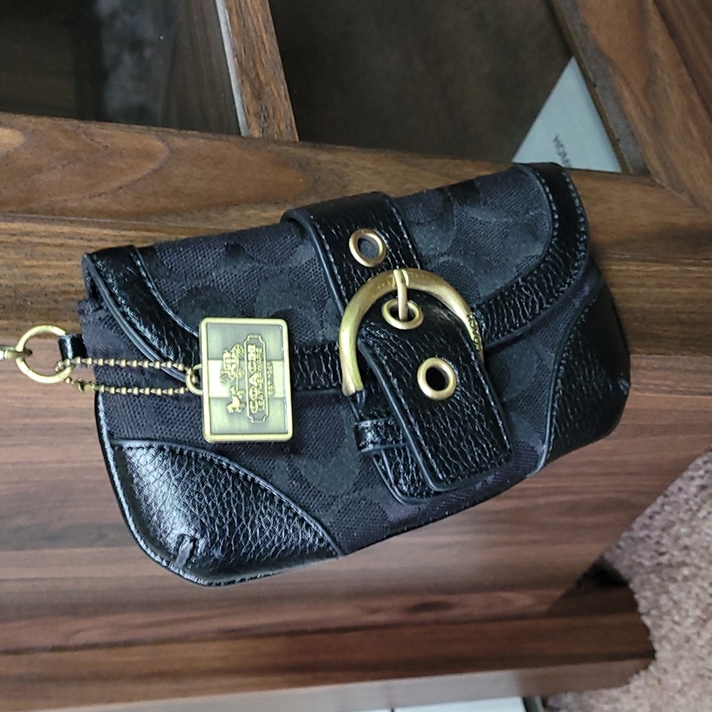 - Coach wristlet black super cute large enough for phone.